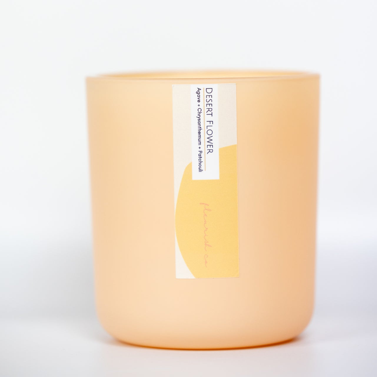 Candle with a label on a white background