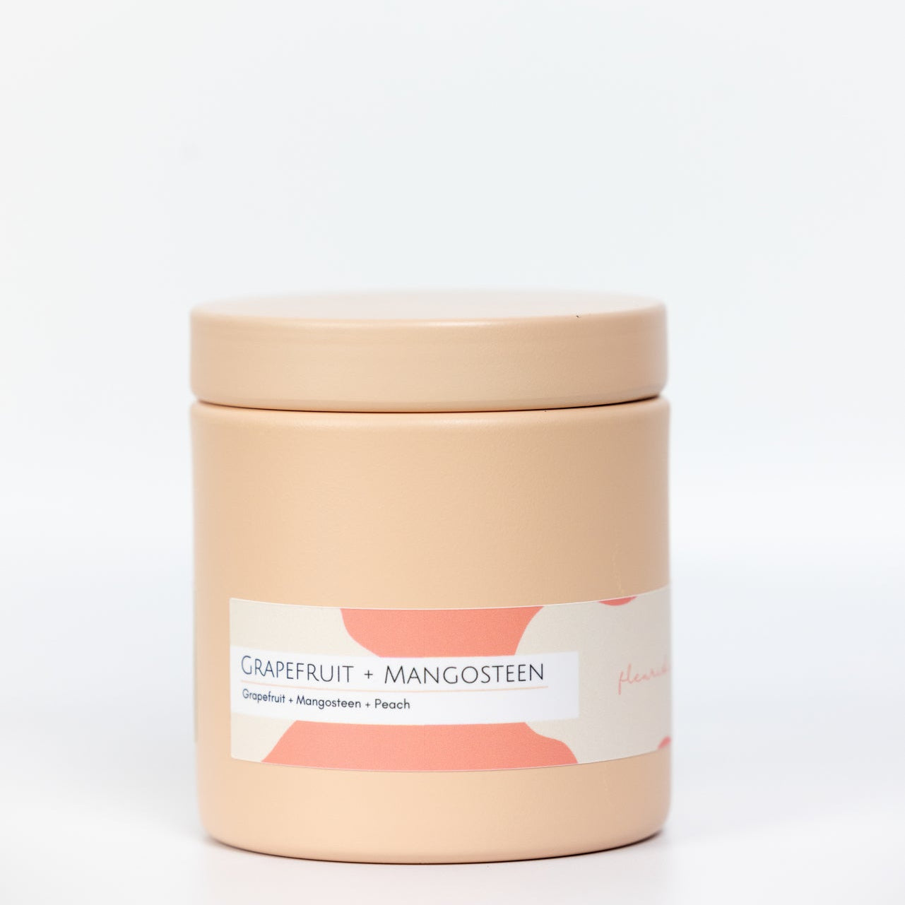 Candle jar with a label on a white background