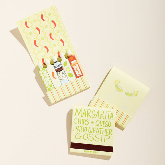 Two small books with colorful covers on a light background