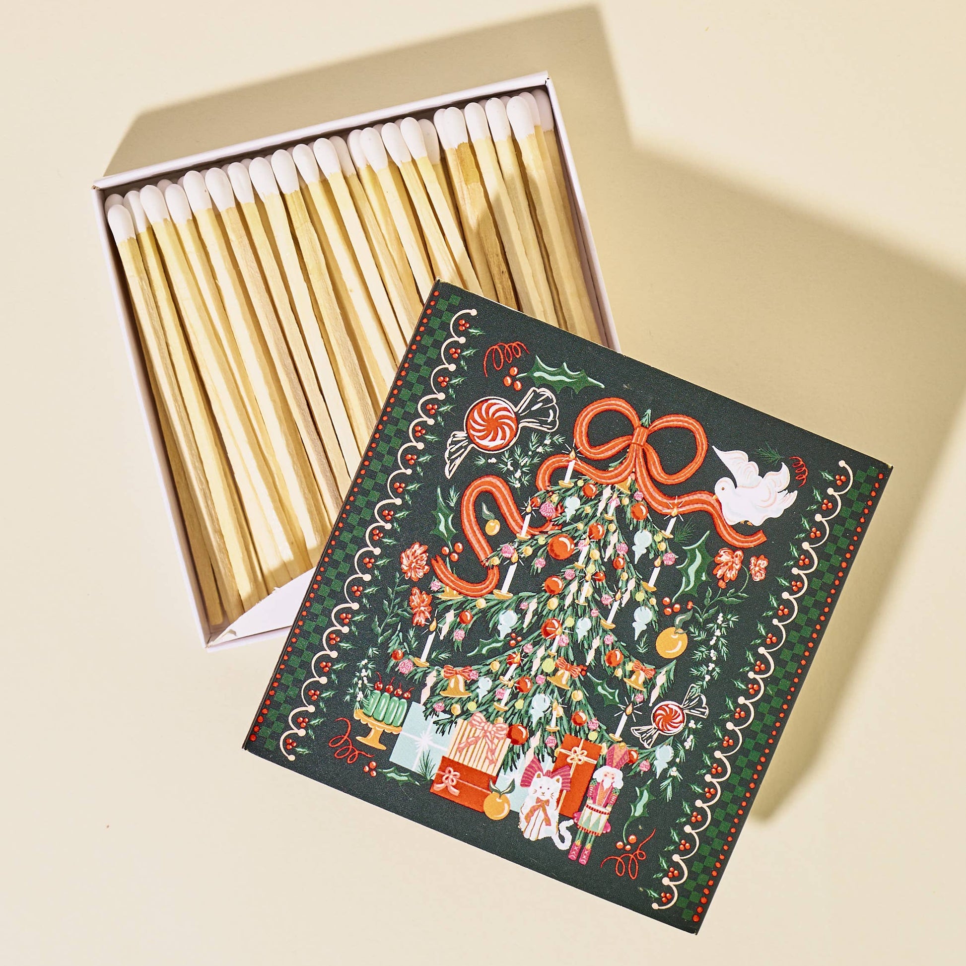 Matches with a decorative box on a beige background