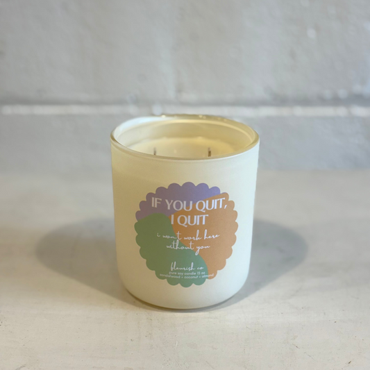 Candle with a motivational quote on a neutral background